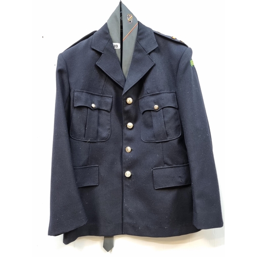 389 - A vintage Irish uniform jacket by J.I. & Son with epaulettes, 'Dublin' patches to shoulders, and but... 