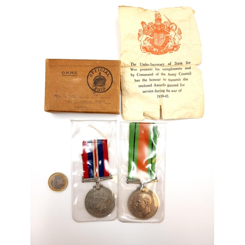 415 - A George VI 1939-1945 WWII medal. Together with a 1939-45 Defence battle medal. Accompanied by its o... 