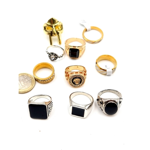 417 - A collection of 10 assorted gents and ladies  rings several new with tags inc gem set examples.