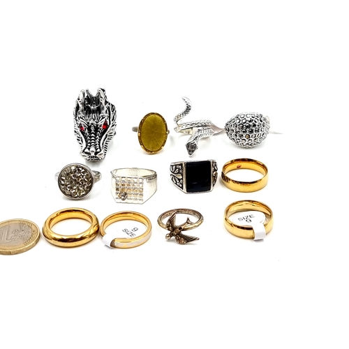 418 - A collection of gents and ladies rings. In an array of styles and designs inc gem set examples.. Inc... 