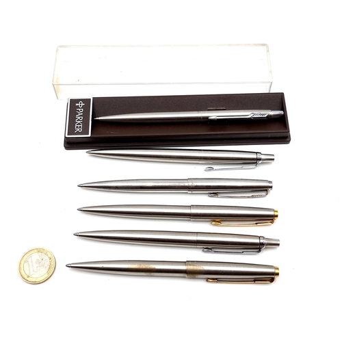 427 - A collection of six vintage polished steal Parker ball point pens.