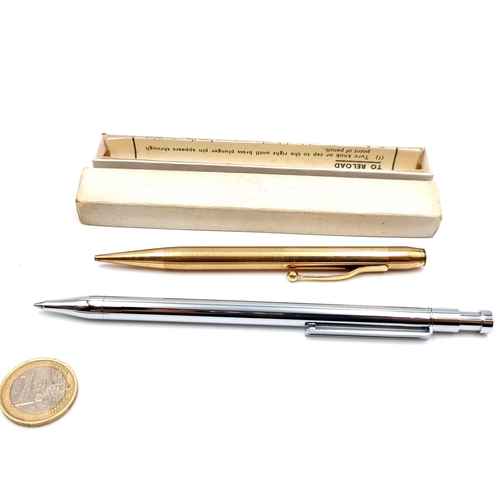 431 - Two pens, the first is a stainless steel sleek Colibri ball point example and a gold toned longer le... 