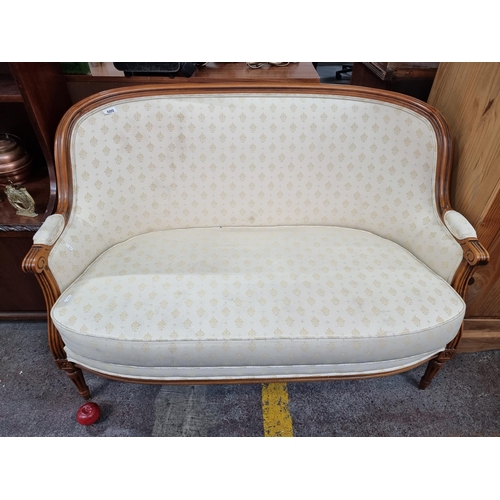 600 - Star lot : A fabulous two-seater sofa with fleur de lis design to upholstery and striking fluted car... 