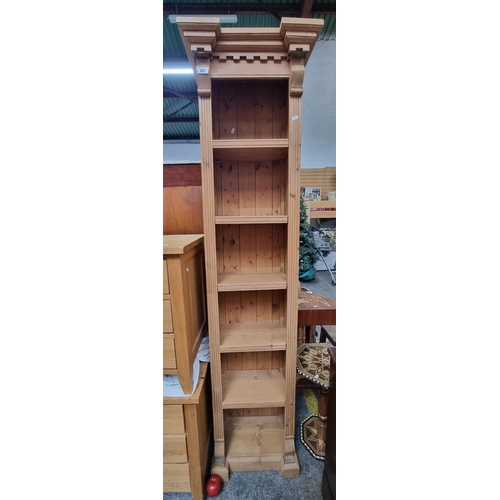 607 - A vintage bookcase with five removable shelves, fluted column carving to sides and a turret-top desi... 