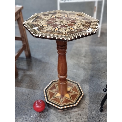 612 - A stunning vintage Sorrento ware side table with turned stem and fabulous marquetry and octagonal fo... 