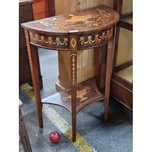 615 - A fantastic, two-tier demi lune table with pull-out drawer, Greek revival inlay and garland motif in... 