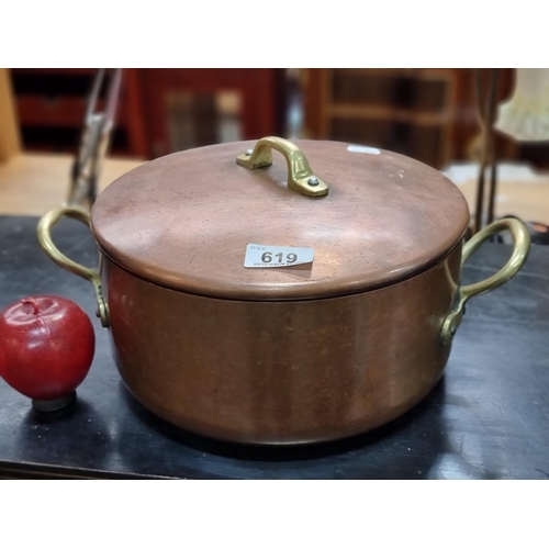 619 - A vintage heavy copper and brass, tin-lined saucepan. Fine quality item.