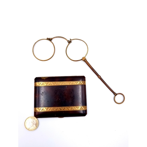 658 - A pair of antique Pinzey glasses, which handle. Together with a tortoiseshell cigarette box, with si... 