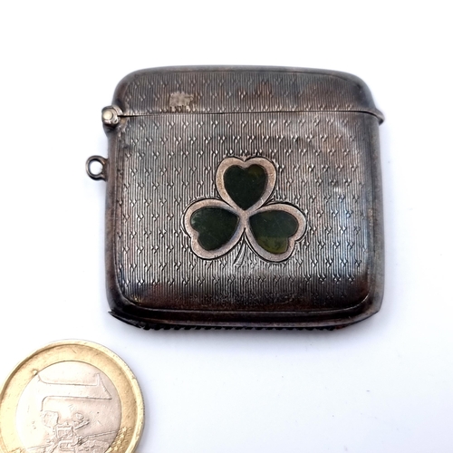 666 - A fine example of a sterling silver vesta case, which features nicely detailed shamrock and machine ... 