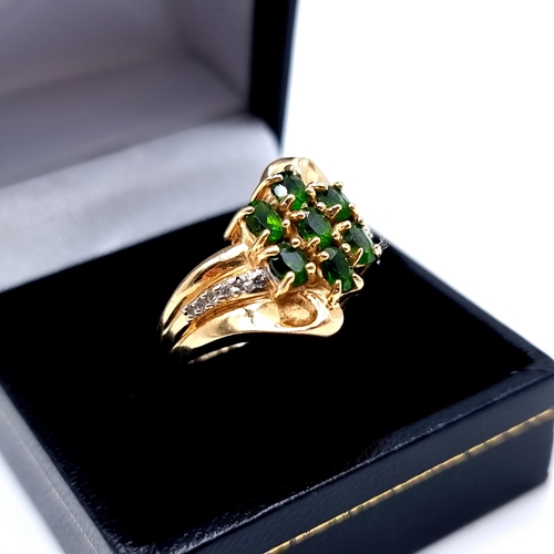 668 - Star lot : A fabulous 14 carat gold vintage seven stone Diopside and Diamond dress ring, with an att... 