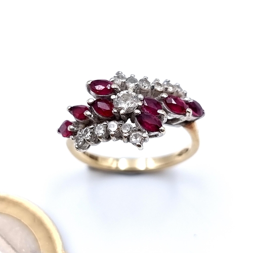 672 - A fine example of an eight stone 9 carat gold ruby stone dress ring, which features a Daimond settin... 