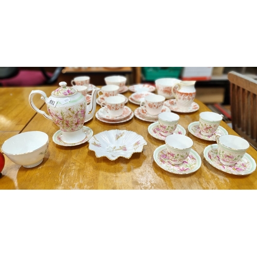 693 - A pretty selection of 12 pieces of fine China in a mint green and rose pink floweral pattern includi... 