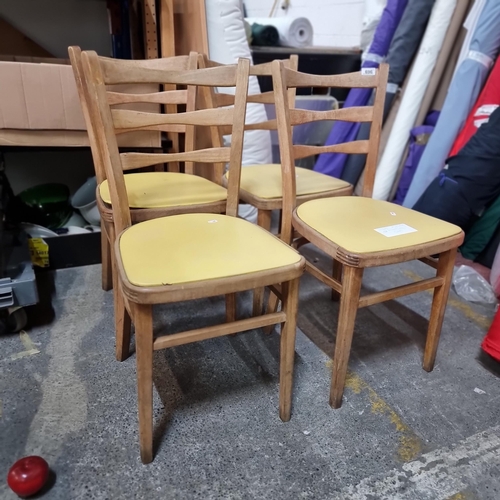 696 - A full set of four mid-century modern dining chairs with carved ladderback and an attractive joinery... 