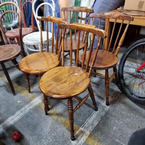 698 - A set of four spindleback vintage chairs with unusual round seats beautifully turned legs and neat s... 