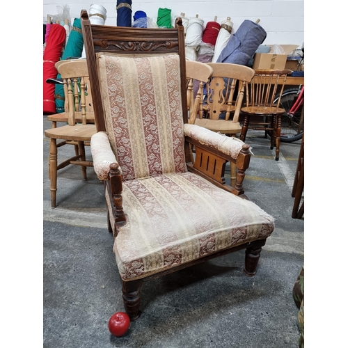 711 - An antique, 19th century Elizabethan style armchair. With reeded detail, carved foliate motifs and o... 