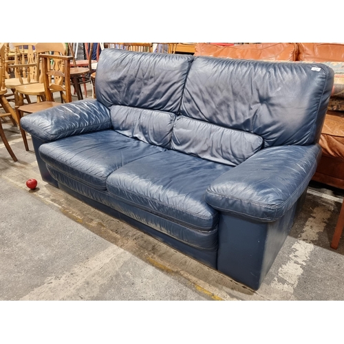 722 - A two seater sofa upholstered in a soft blue leather, very comfortable. In very good clean condition... 