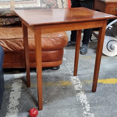 725 - A neat sized wooden side table.