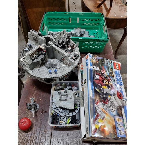 740 - A large collection of Star Wars themed Lego, including a partially completes Death Star with a box o... 