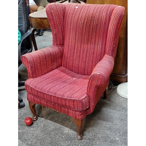 753 - A lovely wingback armchair with cabriole wood legs upholstered in a stripped Jacquard fabric in red ... 