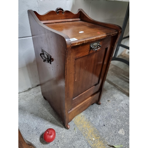 765 - A fabulous Edwardian coal box purdonium with metal drop handles and held on original ceramic casters... 