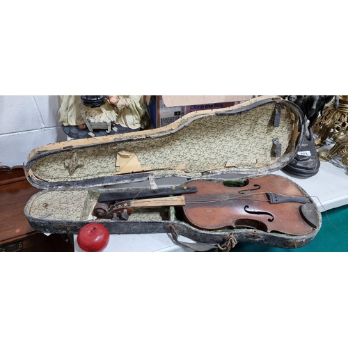 766 - An antique full size violin in original case. Needs some restoration.