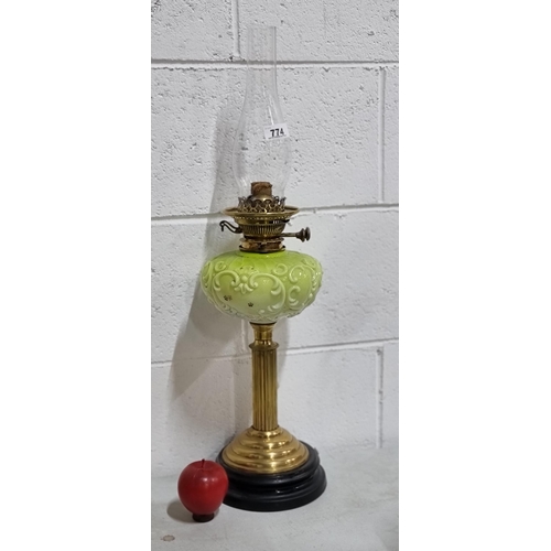 774 - Star lot : A fantastic large antique oil lamp with polished brass base, a lime toned glass well, and... 