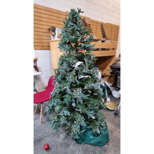 789 - A nicely sized artificial christmas tree with frosted tips and pine coat ornament. Mm: 200cm tall. I... 