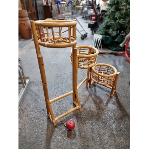 814 - A three tier, triptych, bamboo plant stand with fold-out shelving and bentwood housing.It all folds ... 