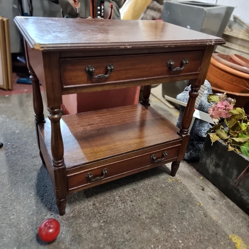 844 - A two tier hall table with turned supports, two pull out drawers and cast swan neck handles.