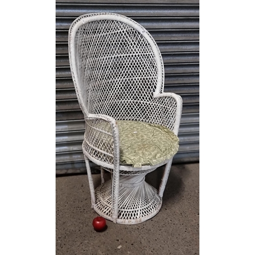 859 - A charming rattan high back tub chair in a cream finish with a complimentary sage green cushion.