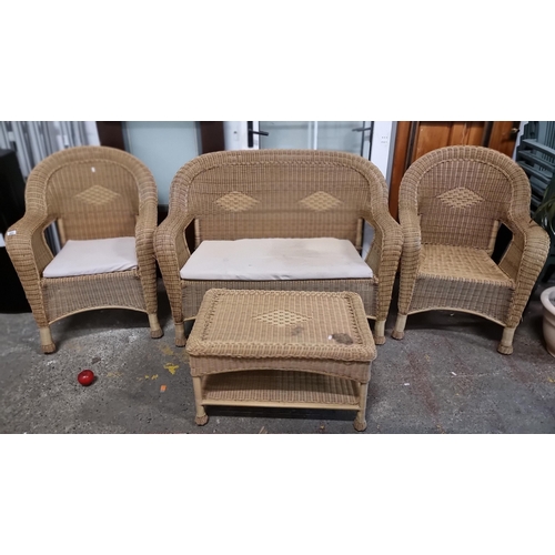 862 - A four piece lounge suite with wicker frame consisting of a two seater sofa, two armchairs and a mat... 