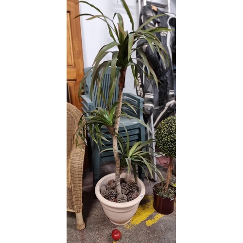 869 - A very tall artificial Yucca plant in a cream planter. One of this size costs over €100 online.