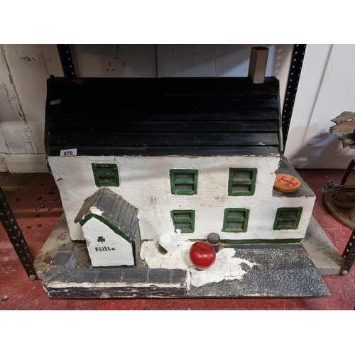 876 - A very charming and heavy sculpture depicting a traditional Irish country pub crafted from plaster a... 