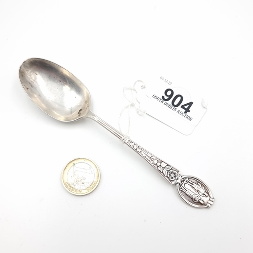 904 - A lovely Sterling Silver, heavy tea spoon with a gentleman with rifle and lady with bow on the top a... 