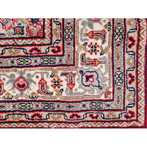 705 - Star lot : A fantastic handknotted wool persian rug from Bidjar, India in an ornate pattern in jewel... 