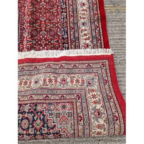 705 - Star lot : A fantastic handknotted wool persian rug from Bidjar, India in an ornate pattern in jewel... 