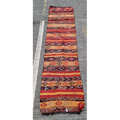 706 - Star lot : A hand knotted wool and horse hair hall runner with geometric pattern in red, blue and or... 