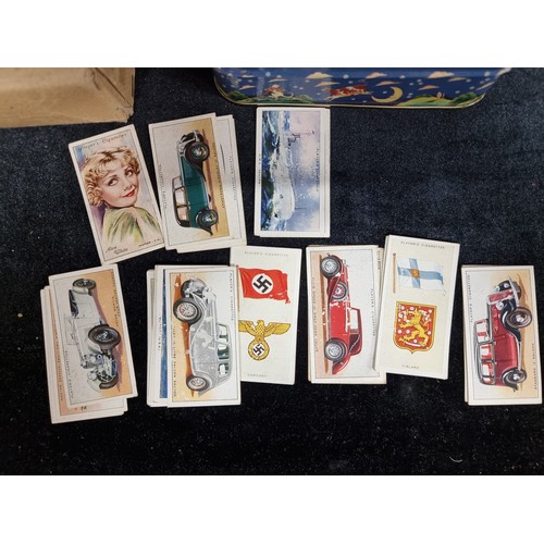 293 - A selection of 3 vintage collectable items, including Player's Cigarettes cards and various world st... 