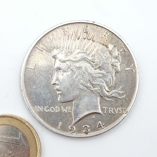 479 - A 1934 silver U.S Peace Dollar reading 