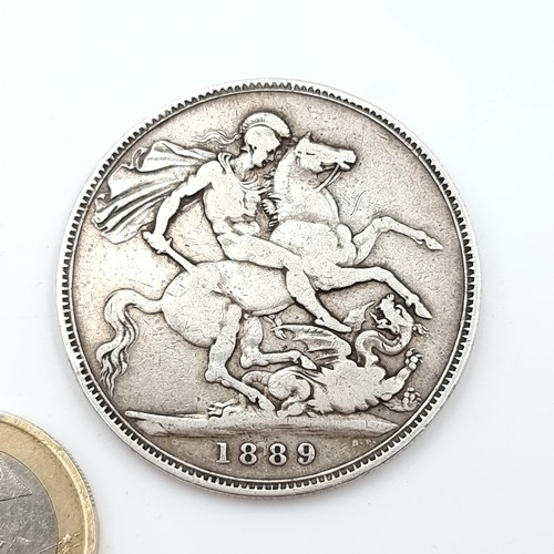 480 - A Jubilee Victoria sterling silver crown coin dating to 1889. 27.75 grams.