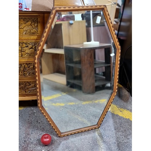 644 - A fabulous Art Deco wall mirror with an octagonal, bevelled glass housed in a lovely frame with a ge... 