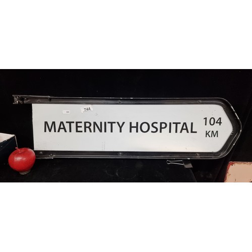 744 - A heavy road sign reading Maternity Hospital 104 km in a cast metal frame. . Seems like a long way a... 