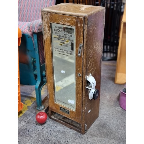 817 - Star Lot : A very interesting, vintage clean towel dispenser with a mechanical system and slots for ... 