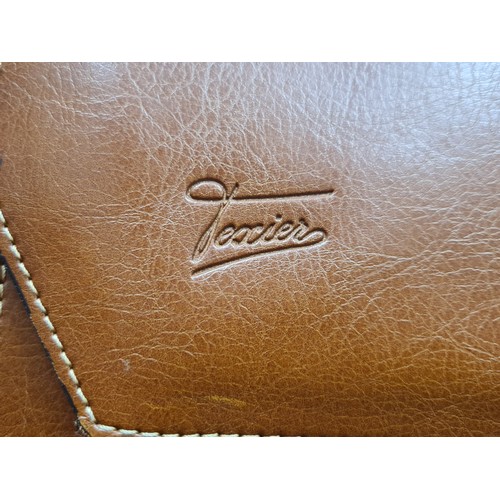 111 - A very high quality genuine leather, French made Texier briefcase. With brass hardware, a zipped int... 