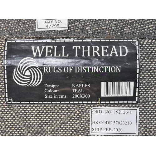 473 - A fantastic, large, floor rug by ''Well Thread'' company. In the Naples series, in the teal colourwa... 