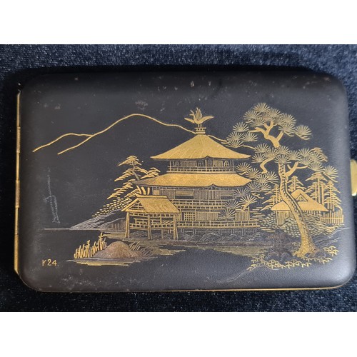 240 - Two vintage items, including a Japanese powder compact and music box with a mother of pearl temple s... 