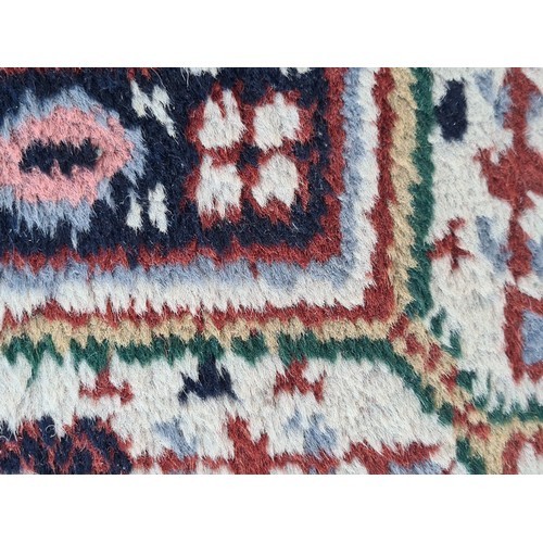 74 - Star lot : A fabulous large hand made and hand knotted persian rug in shades of red, blue and green.... 