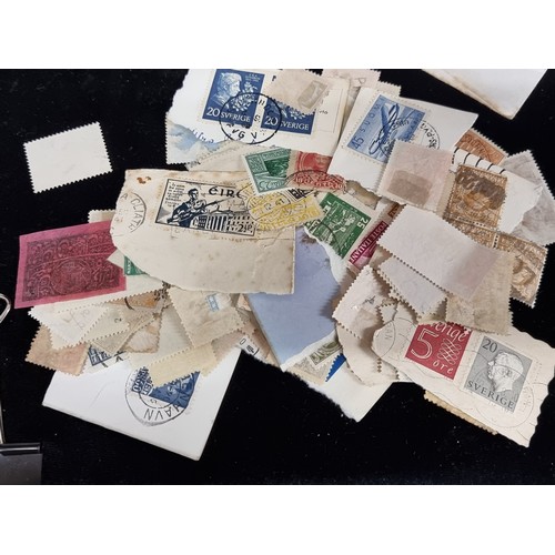 406 - A large collection of stamps, which includes Moroccan and continental examples. Together with an ass... 