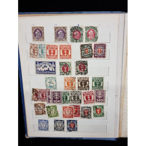 683 - An album of mint and cancelled older German Stamps pre WW2. Including over prints and Mint sets.