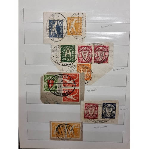 683 - An album of mint and cancelled older German Stamps pre WW2. Including over prints and Mint sets.